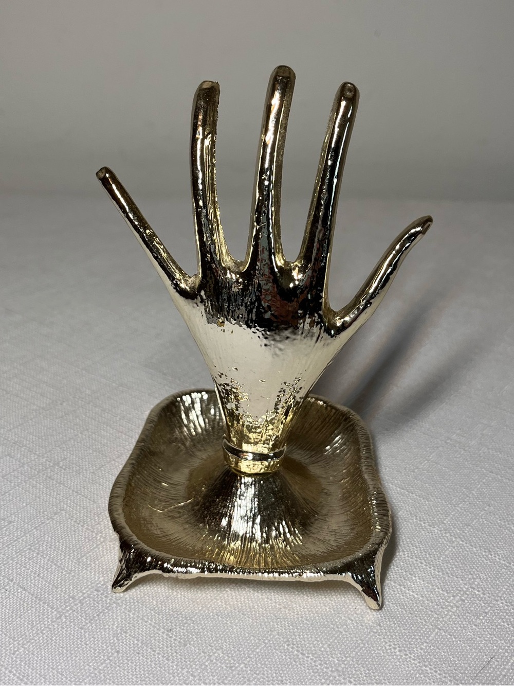 vintage 1970s gold-toned metal hand ring holder and tray. Jewelry holder